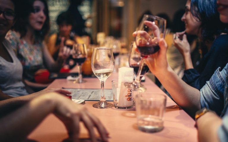 VIN-WINE-drinking-liquor-and-talking-on-dining-table-close-up-696218
